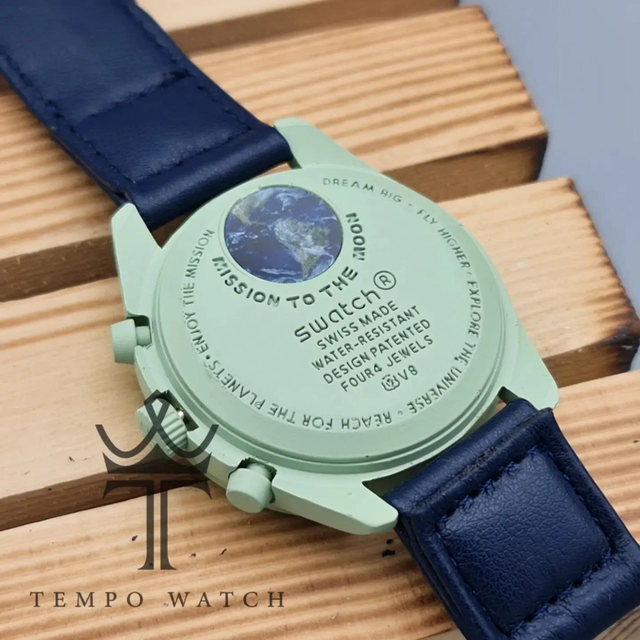 پشت ساعت مچی امگا سواچ سرمه ای پشت ساعت مچی امگا سواچ سرمه ای